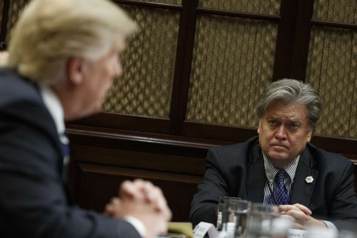White House Chief Strategist Steve Bannon listens at right as US President Donald Trump speaks during a meeting on cyber security in the Roosevelt Room of the White House in Washington. Photo: AP