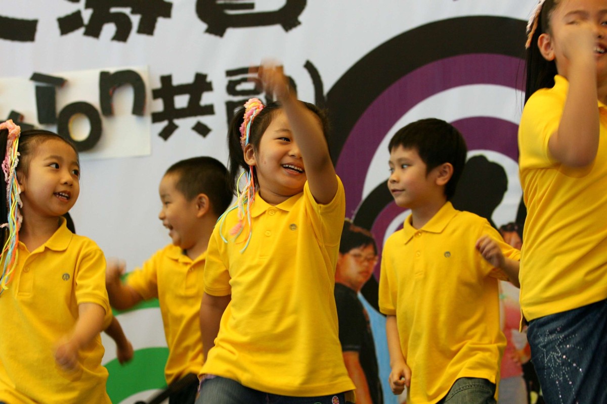 Children from Ng Sheung Nang Kindergarden perform a fitness dance routine. The government is set to extend a programme to make kindergarten education free for more children. Photo: Jonathan Wong