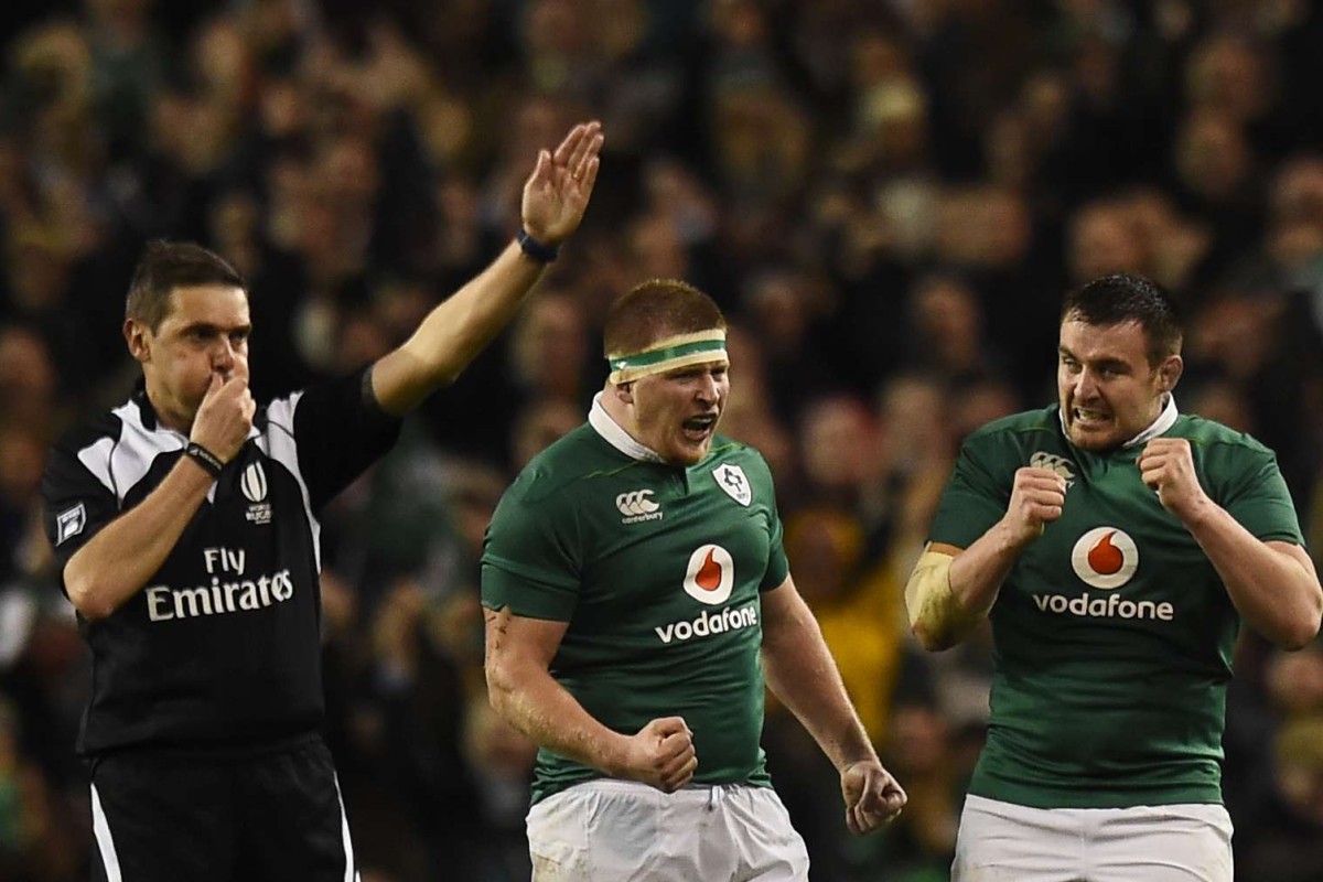 The referee blows the whistle at full time, sparking Irish celebrations. Photo: Reuters