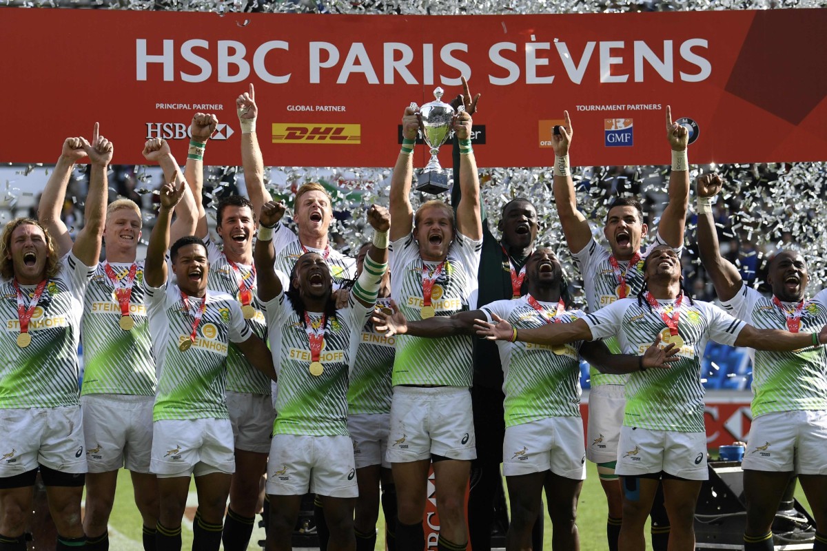 South Africa celebrate on the podium during the trophy ceremony after winning the Paris Sevens. Photo: AFP