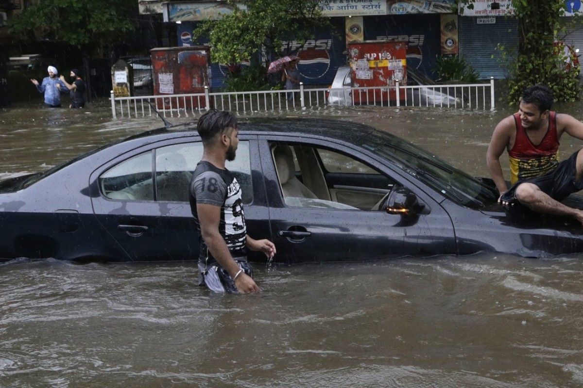 Floods swamp Mumbai after month’s worth of rain falls in a single day ...