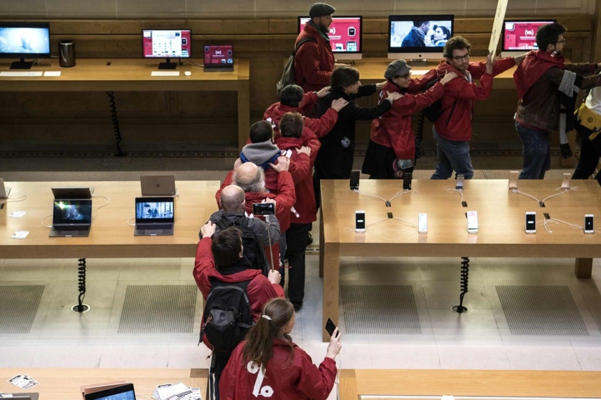 Activists occupy Paris Apple store over Europe tax dispute South