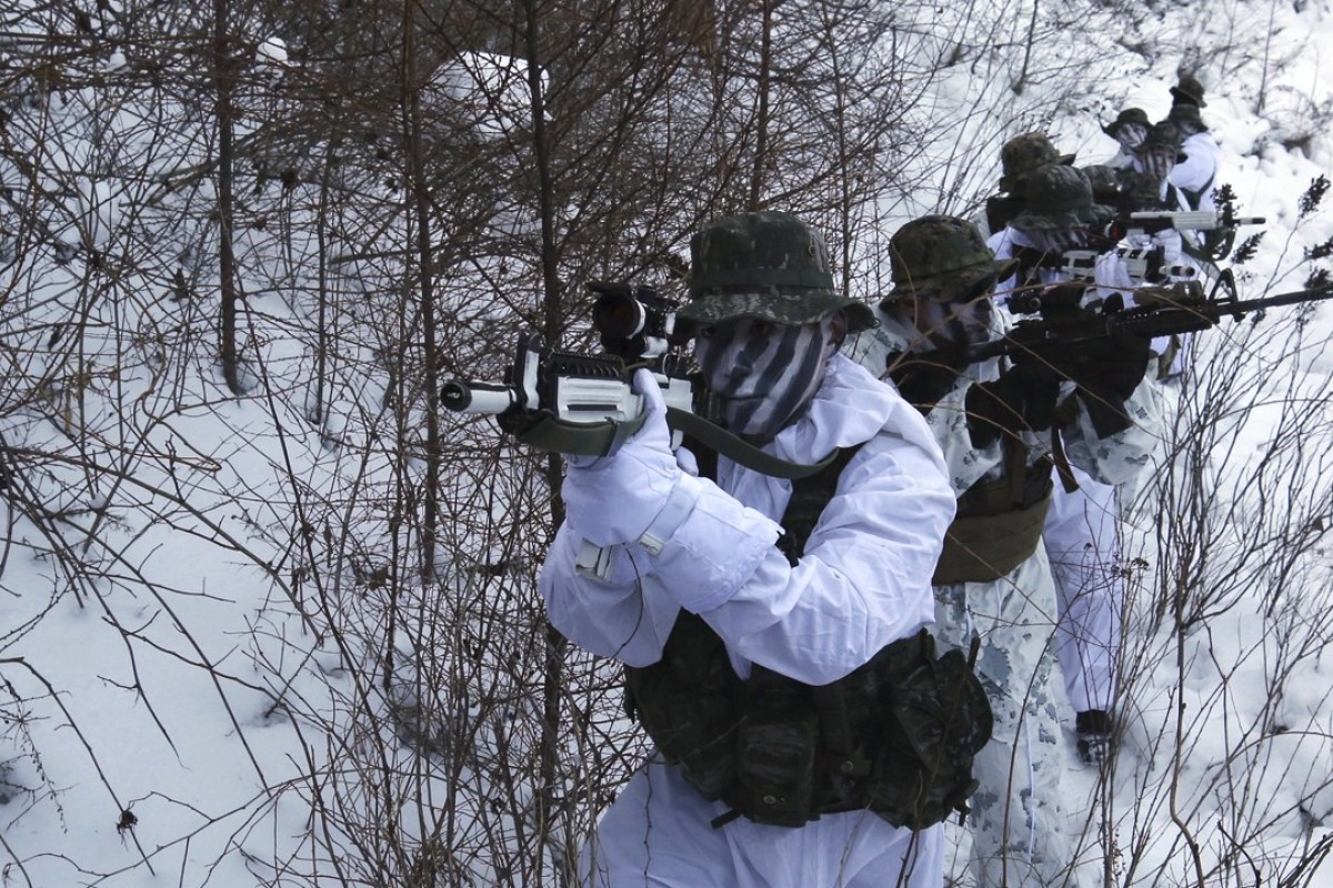 South Korean and US Marines from III-Marine Expeditionary Force from Okinawa, Japan, patrol through the snow during their joint military winter exercise in Pyeongchang, South Korea, in December. The US is actively preparing for a possible war, top US brass have confirmed. Photo: AP