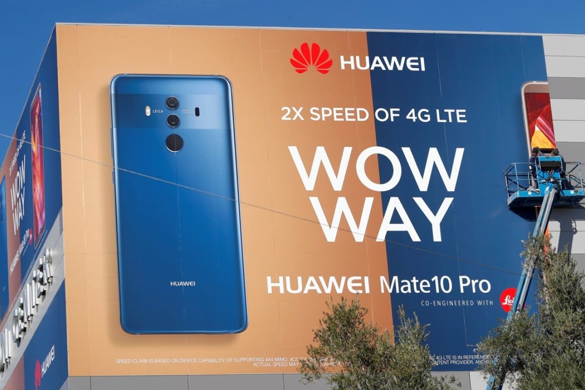 A crew hangs a Huawei Technologies smartphone advertising banner on the side of the Las Vegas Convention Centre during the 2018 CES trade show earlier this month. Huawei has failed to forge a smartphone distribution deal with a major American mobile network operator because of US security concerns. Photo: Reuters