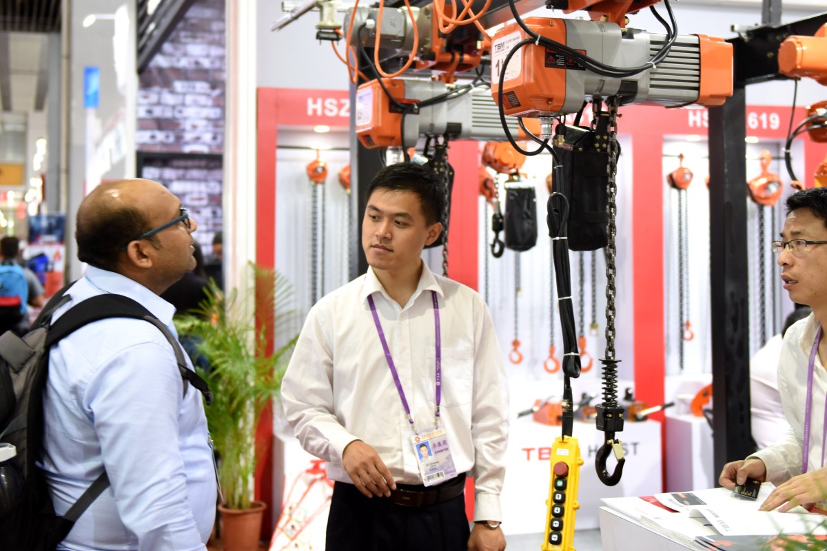 A businessman viewing machinery at the China Import and Export Fair in Guangzhou this week. Photo: Xinhua