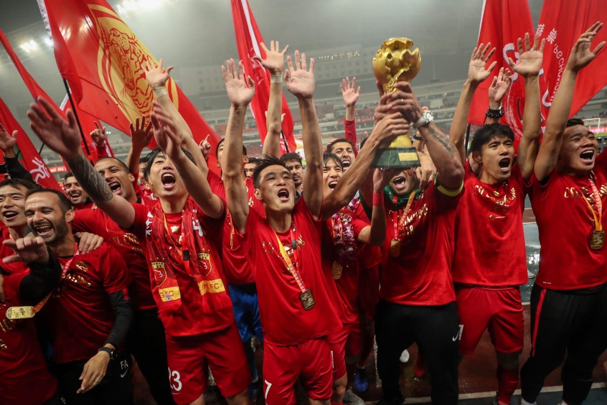 Shanghai SIPG players celebrate with the trophy after winning the Chinese Super League. Photo: AFP