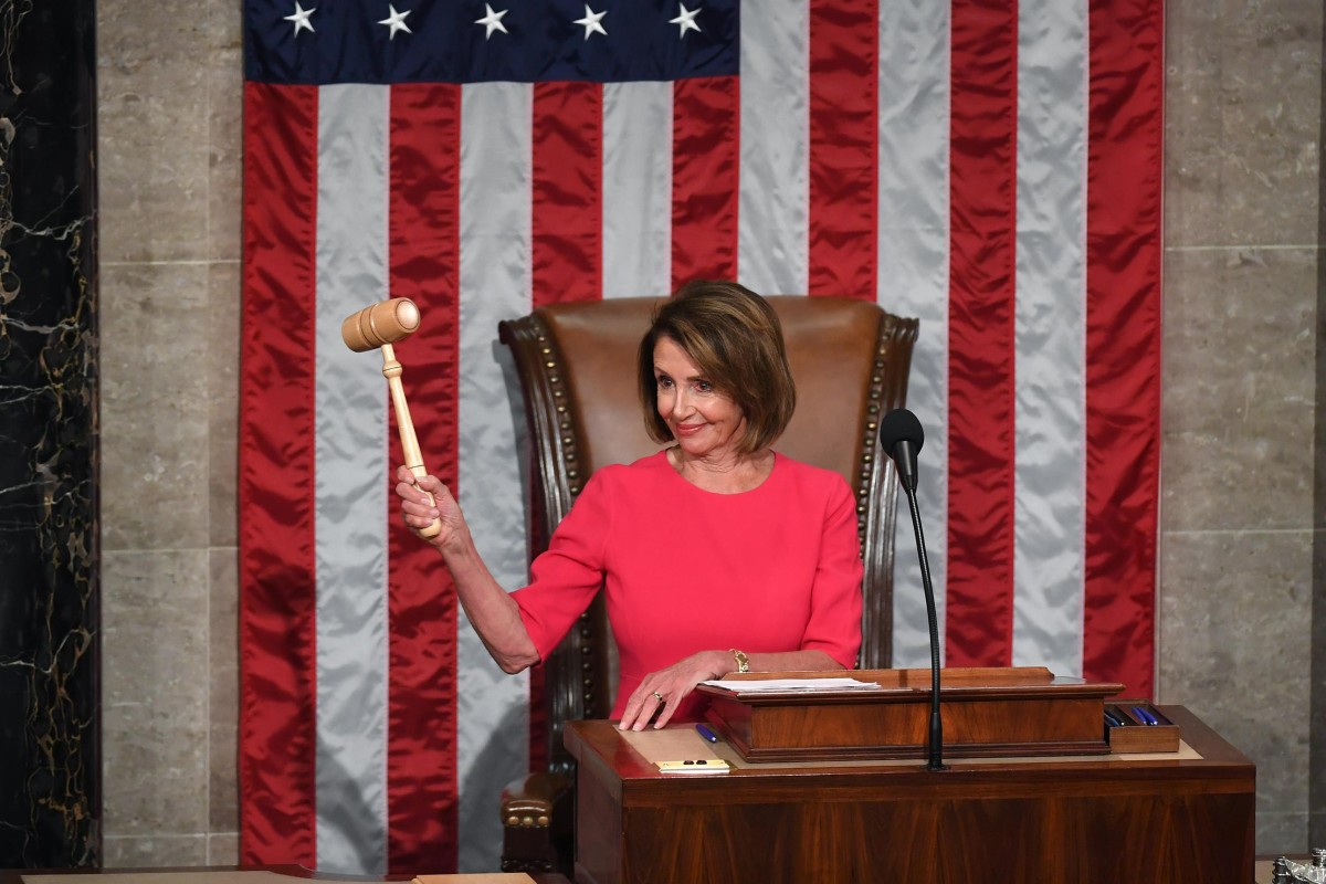 Speaker of the House Nancy Pelosi holds up the gavel as the 116th Congress convenes. Photo: The Washington Post
