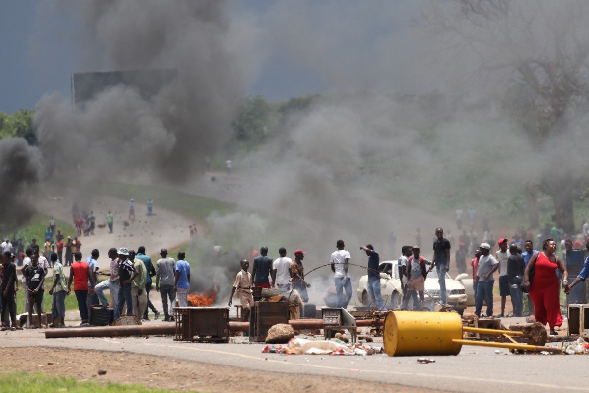 Protesters block a major road leading into the city centre in Harare, Zimbabwe, on Monday. Photo: EPA