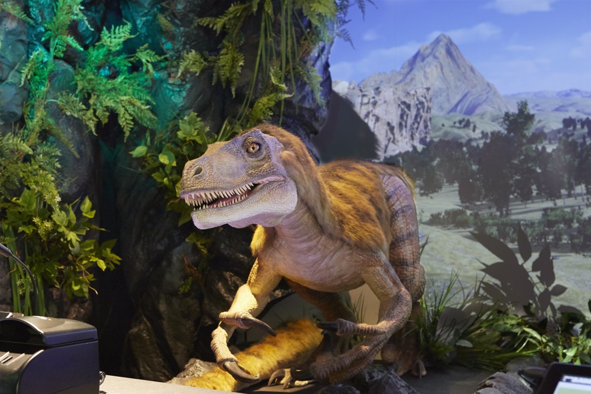 Henn-na Tokyo hotel’s dinosaur at the reception desk is programmed to speak the language of guests when they check in.