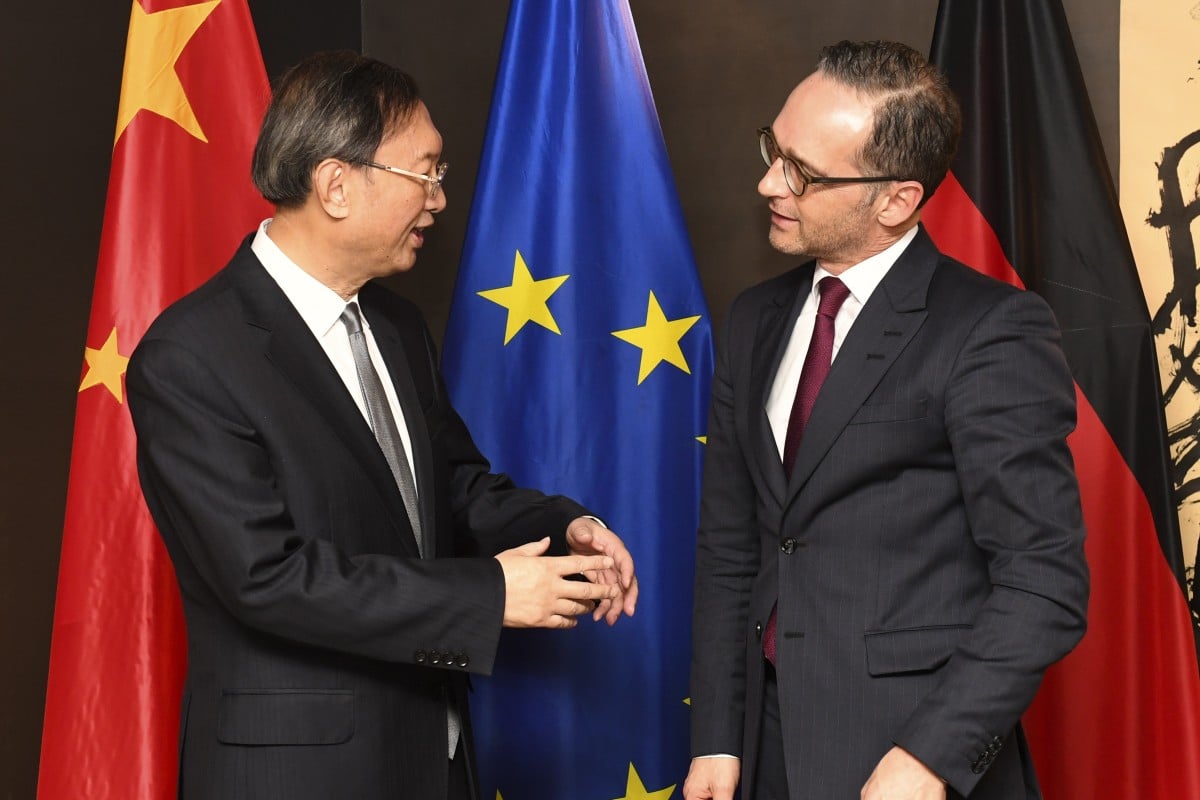 Chinea’s top envoy Yang Jiechi chats to German Foreign Minister Heiko Maas at the Munich Security Conference. Photo: AP