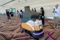 An automatic robot vacuum cleaning the floor at the newly built Changi airport terminal four in Singapore. Photo: AFP