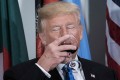 US President Donald Trump sips a glass of Diet Coke after making a toast during a lunch at the United Nations headquarters in New York. Photo: AP