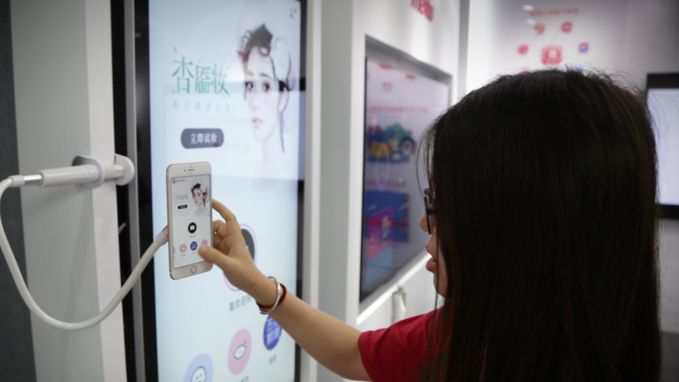 Meitu staff demonstrating the app at its headquarters in Xiamen. (Picture: Abacus)
