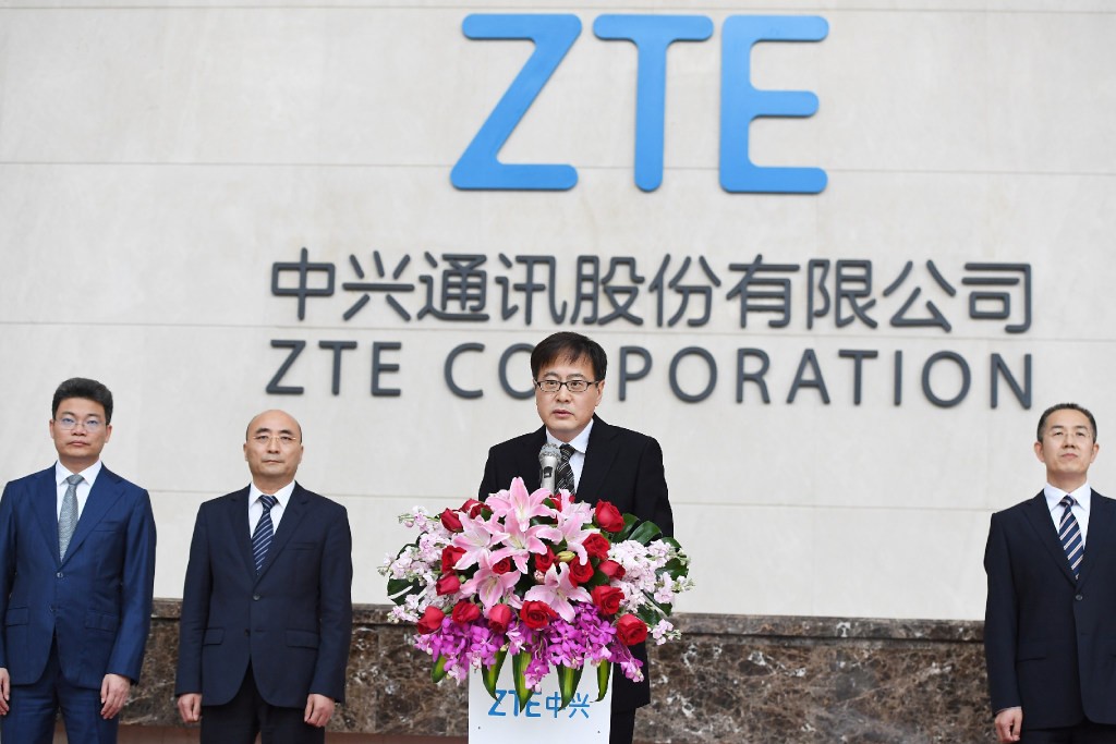 ZTE chairman Yin Yimin (on podium) said in a memo, “We need the combined strength of ZTE’s 80,000-strong staff in this tough time.” (Picture: CNS)