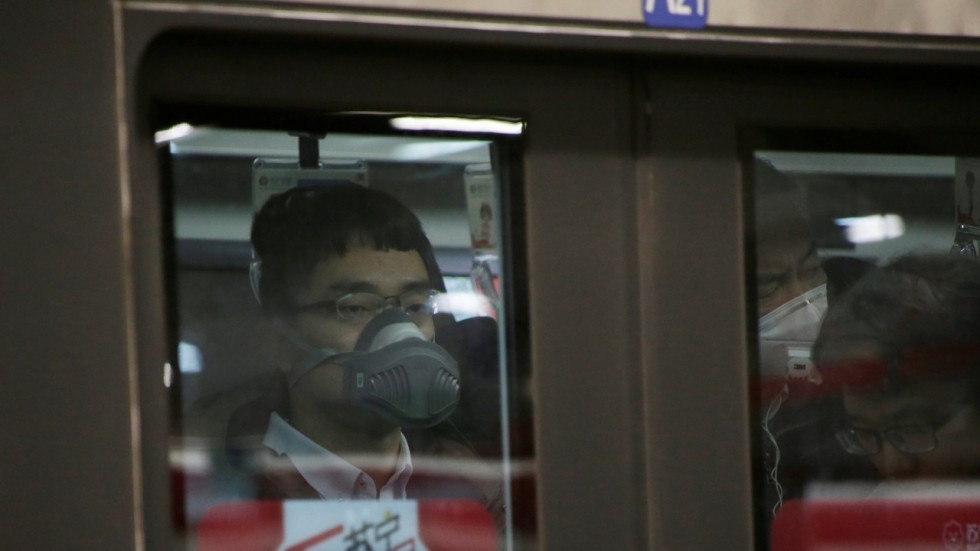 Beijing is polluted and passengers wear face masks underground where there are even more pollutants. (Picture: Reuters)