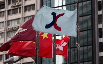 Flags flying outside the Hong Kong stock exchange. Photo: EPA
