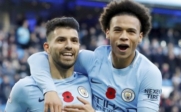 Sergio Aguero (left) celebrates with Leroy Sane after scoring against Arsenal. Photo: AP