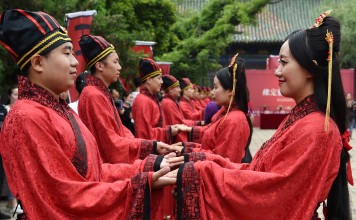 A mass wedding in Shanxi province during Qixi Festival. The younger generation considers the festival a Chinese version of Valentine’s Day, buying gold jewellery as a token of love. Photo: Xinhua