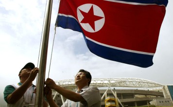 The North Korea national flag is hoisted in front of the main stadium in Daegu. Photo: AFP