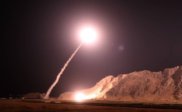 This handout photo provided by Iran's Revolutionary Guard official website shows a missile being launched at militants in eastern Syria. Photo: AFP