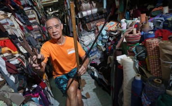 Fabric vendor Chan Yu-tung in his shop at Yen Chow Street Hawker Bazaar in Sham Shui Po. Photo: David Wong