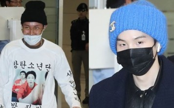 BTS members J-Hope (left) and Suga wear masks at Incheon International Airport on Tuesday after the boy band arrived back in South Korea after performing concerts in North America and Europe as part of its world tour. Photo: Yonhap