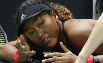 Naomi Osaka receives treatment on the court during a medical timeout against Kiki Bertens at the WTA Finals in Singapore. Photo: AP