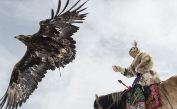 Huntress Aigerim Asker trains ahead of the Golden Eagle Festival, in Ölgii, Mongolia, in October. Picture: Zigor Aldama