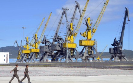 North Korean soldiers march near loading machinery at the port of Rajin. Photo: Reuters North Korean soldiers march near loading machinery at the port of Rajin. Photo: Reuters