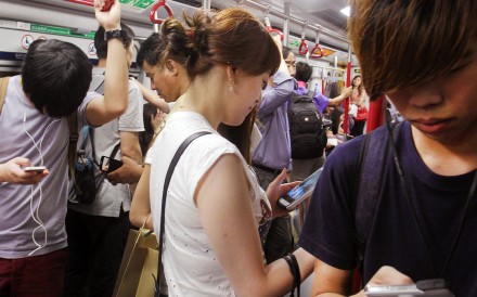 The MTR Corp worries that passengers checking their phones are not paying adequate attention to safety concerns. Photo: Dickson Lee