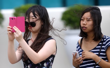 Hong Kong smartphone users are among the clumsiest in Asia, according to a new report. Photo: Sam Tsang