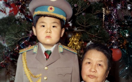 Kim Jong-nam dressed in an army uniform with his maternal grandmother in January 1975. Picture: AFP
