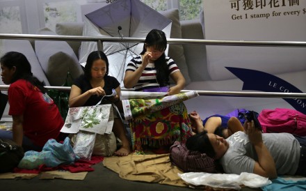 Domestic workers meet in Central on a day off in June last year. There are more than 300,000 migrant domestic workers employed in Hong Kong, a majority of them originating from Indonesia and the Philippines. Photo: AFP