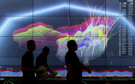 Attendees walk past a live visualisation of internet attacks across China during the 4th China Internet Security Conference (ISC) in Beijing last year. Photo: AP