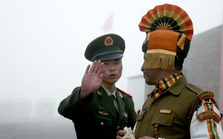 Chinese and Indian soldiers on the border in Sikkim state. Observers say the end of the stand-off was apparently timed to ease tensions ahead of a high-profile BRICS summit next week in China. Photo: AFP