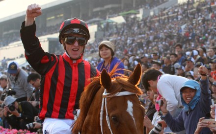 Zac Purton celebrates winning the Hong Kong Cup aboard Time Warp. Photos: Kenneth Chan