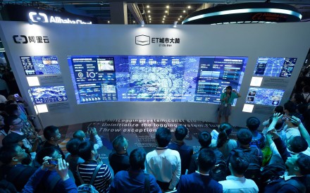 This October 11, 2017 photo shows visitors watching a visual logging system of city power data on the Computing Conference 2017 in Hangzhou. Photo: AFP