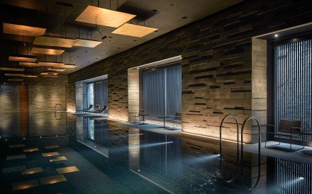Interior designer Koichiro Ikebuchi designed a swimming pool inspired by Japan’s onsen for the clubhouse of the Pavilia Hill residential development in Tin Hau, Hong Kong.