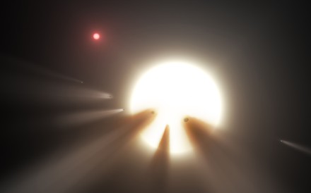 Despite speculation that the pulsing seen on KIC 8462852 – known as “Tabby’s Star” – might be due to an orbiting alien megastructure, scientists now believe that its unusual light signals are likely from dusty comet fragments that blocked the light of the star as they passed in front of it in 2011 and 2013. This Nasa handout image shows an illustration of a star behind a shattered comet. Picture: Nasa/JPL Caltech handout via AFP