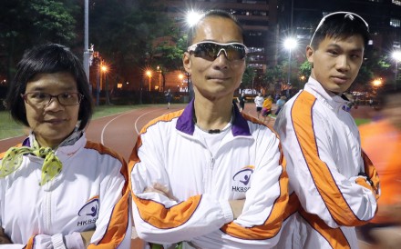 Blind runners Kong Kwok-lin, Gary Leung Siu-wai and Chu Kin-wa pose for a portrait at the Sham Shui Po Sports Ground. Photo: K.Y. Cheng