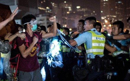 Protesters and police clash during the 2014 Occupy movement, the consequences of which are still reverberating today in court cases that have sparked controversy. Photo: AFP/ Alex Ogle