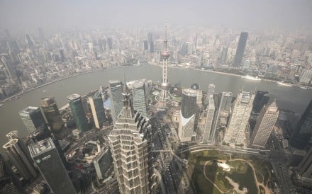 The city as seen from the Shanghai World Financial Centre. The study by BCG says 23 per cent of the jobs in China’s banking, insurance and securities sectors will be affected. It also says AI will improve the efficiency of the remaining employees by 38 per cent. Photo: Bloomberg