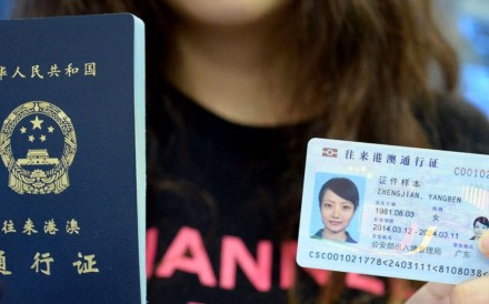 A model displays a Chinese passport and mainland ID card, similar to the one that will be issued to residents of Hong Kong, Macau and Taiwan. Photo: Weibo