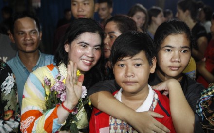 Tep Vanny waves as she arrives home in Boeung Kak, Cambodia. Photo: AP