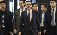 US Treasury Secretary Steven Mnuchin (centre) leaves a hotel in Beijing. Photo: Bloomberg