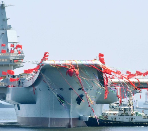 China's first domestically built aircraft carrier, the 50,000-tonne Shandong, is launched at a shipyard in the northeastern port city of Dalian. Photo: Kyodo