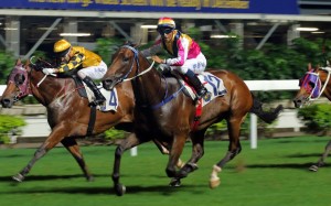 Karis Teetan gets Blocker Dee (outside) over the line to win the last and bring up a treble for trainer Caspar Fownes. Photos: Kenneth Chan