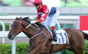 Joao Moreira gives a fist-pump as Joyful Trinity runs over the top of his rivals in the Group Three Celebration Cup. Photos: Kenneth Chan