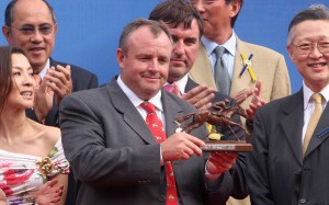 Mike de Kock collects his trophy for winning the Audemars Piquet QE II Cup with Irridescence in 2006. Photos: Kenneth Chan