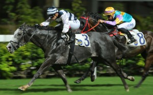 Umberto Rispoli pushes Rickfield to the line at Happy Valley on Wednesday night. Photos: Kenneth Chan
